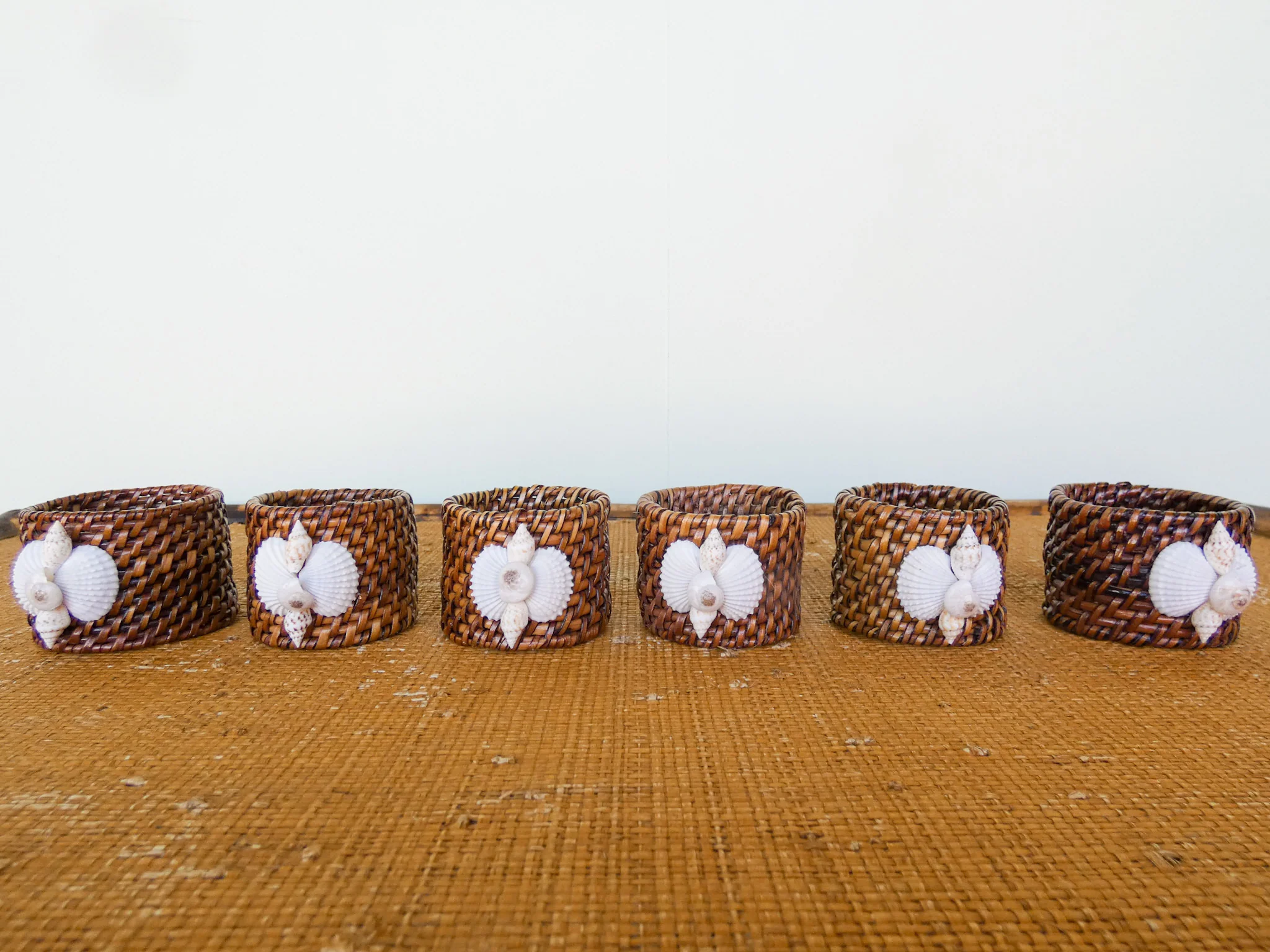 Set of Six Rattan Placemats and Shell Napkin Rings - Image 4